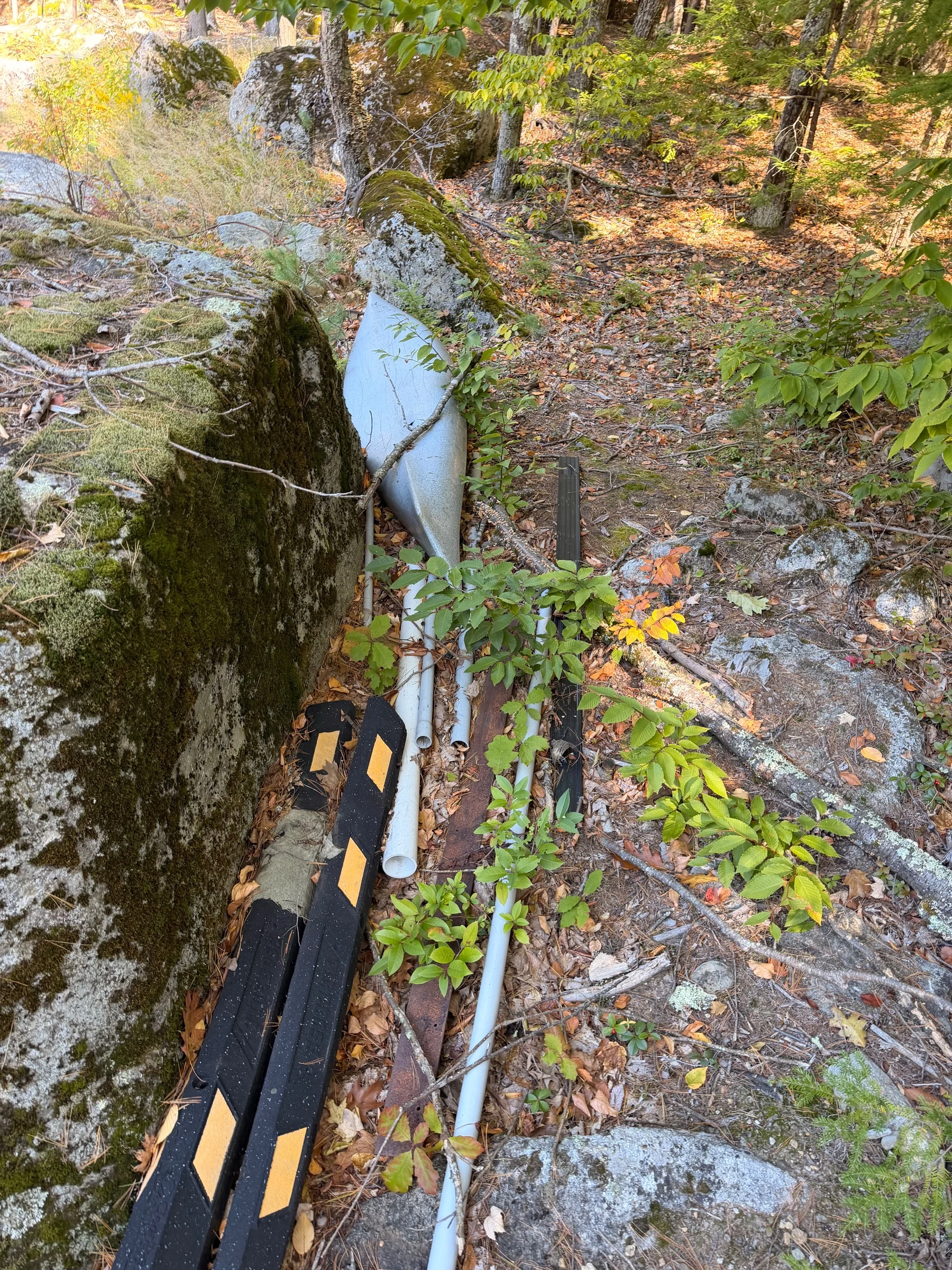 Kayak with a hole, Old curbing, pipe