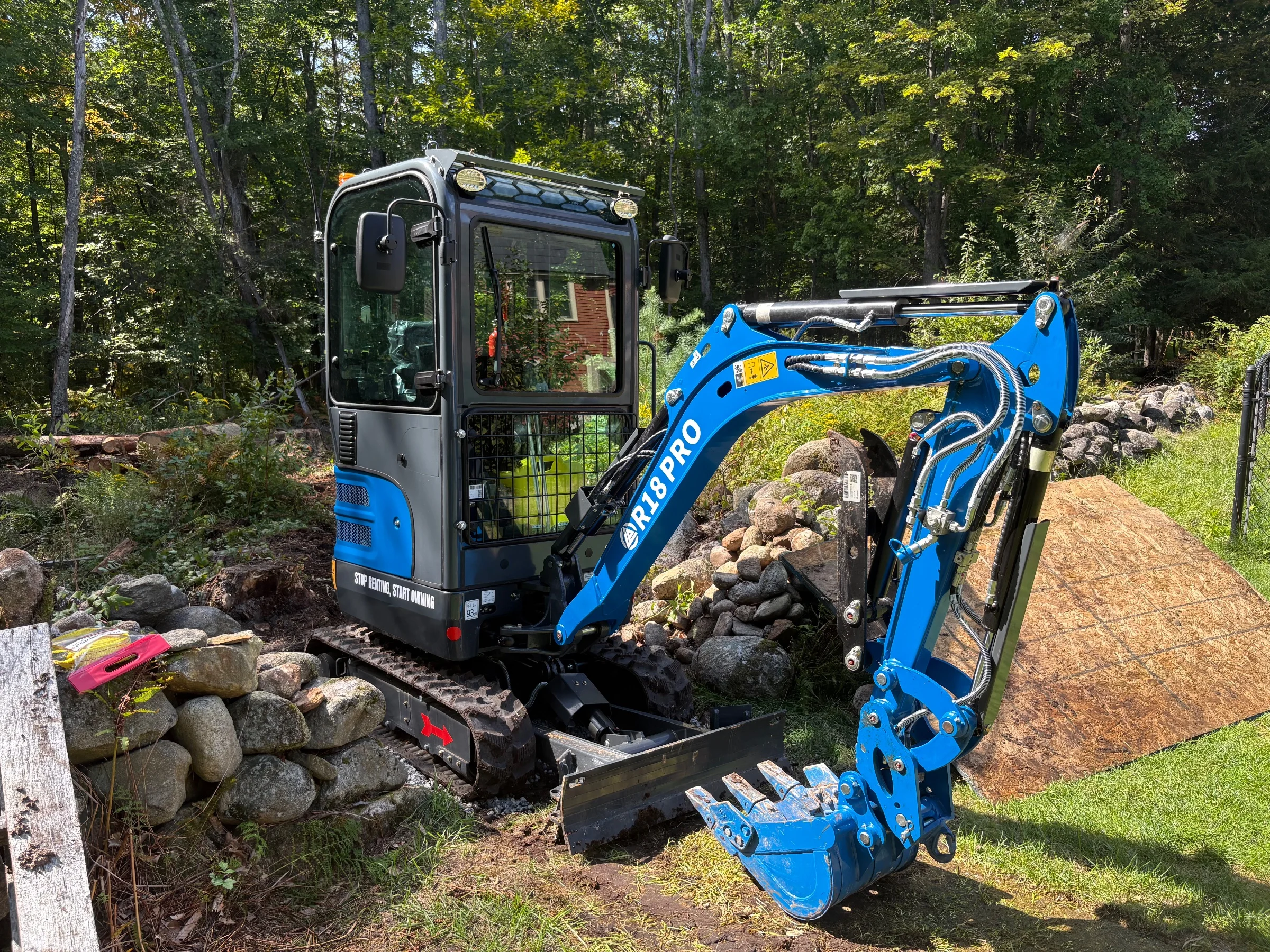 Mini excavator. 4,000+ lbs, retractable undercarriage which narrows to 39".